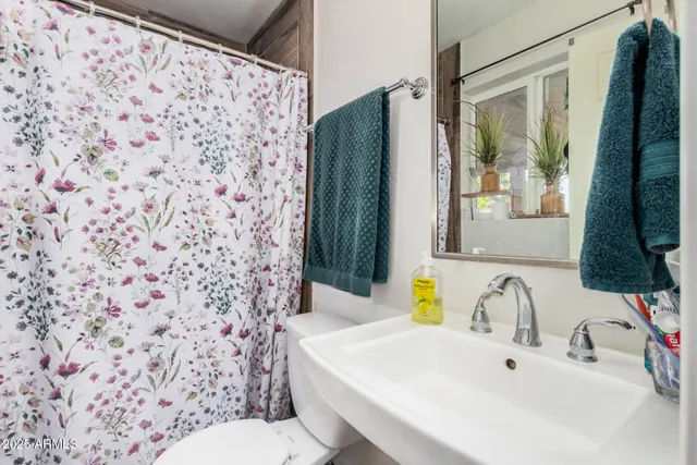 a bedroom with a large bed and a large window