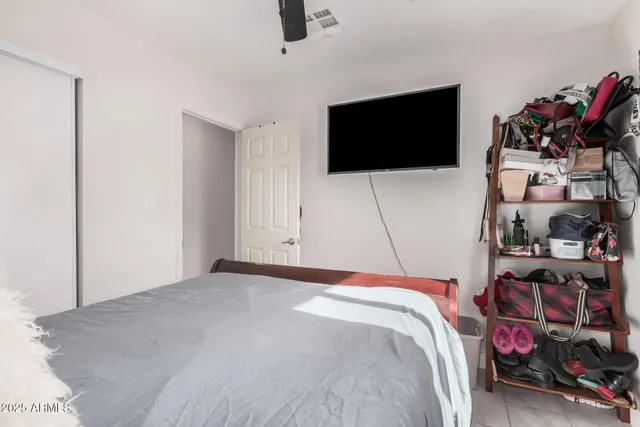 a bedroom with furniture and a bed