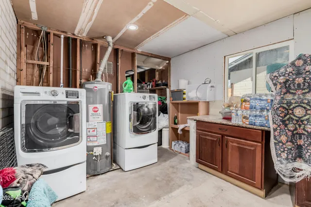 a view of a backyard with chairs and a patio