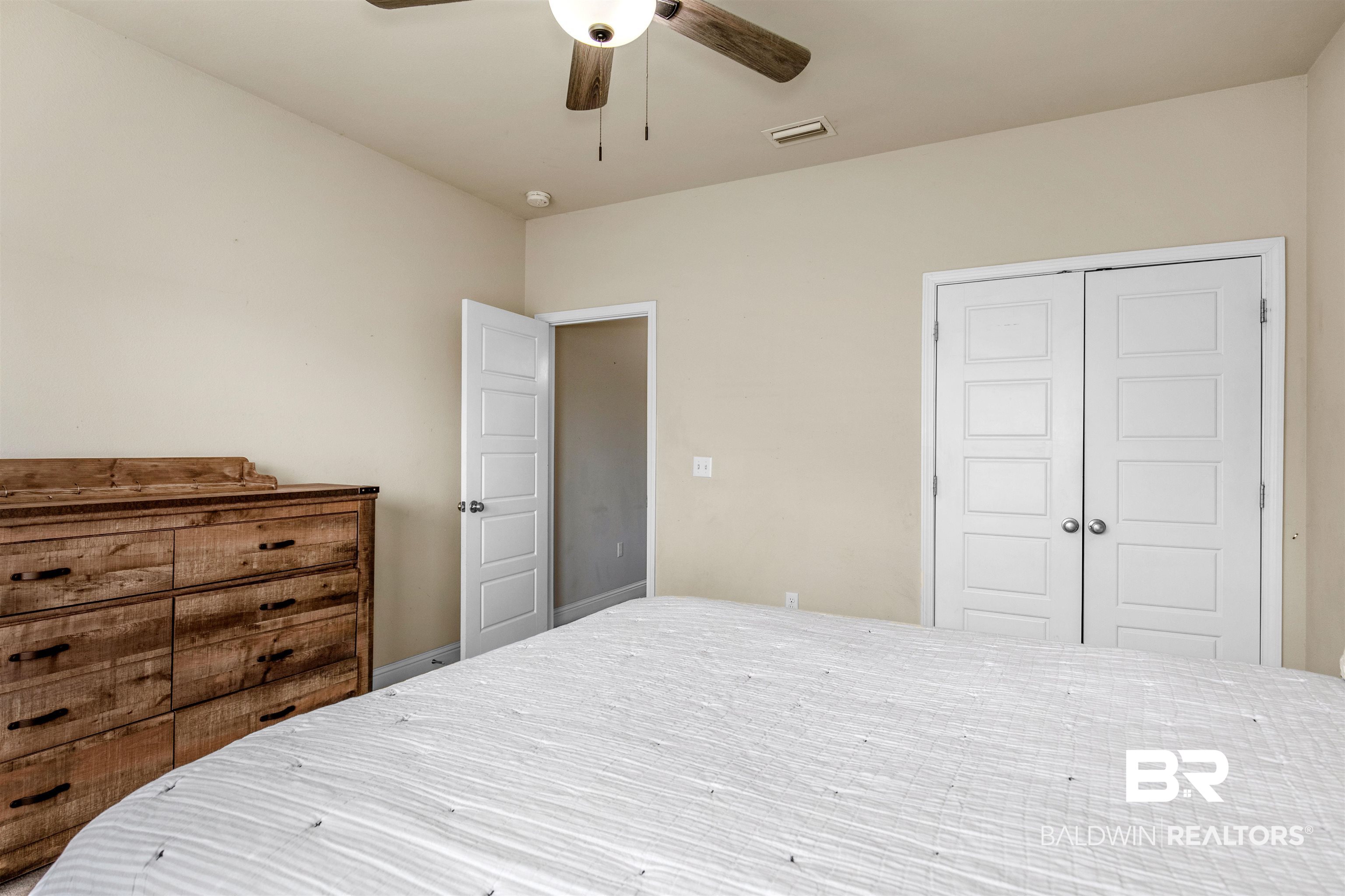 122 Open Field Drive Fairhope, AL 36532 - Photo 17 of 27 Bedroom featuring ceiling fan and a closet