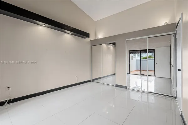 a view of empty room with a view of bathroom