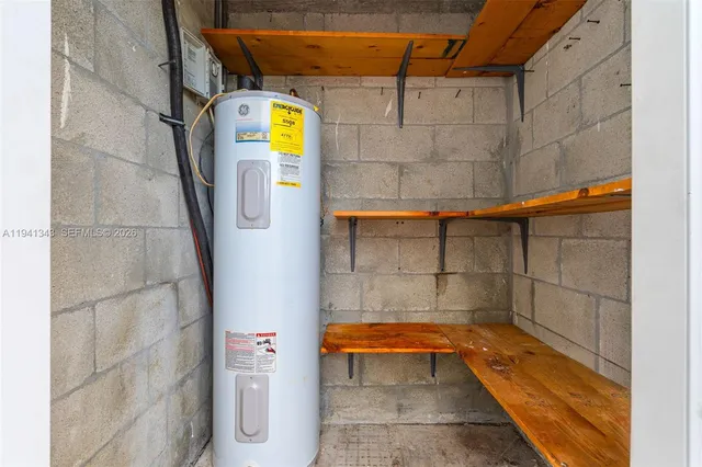 a brick building with a bench and a table