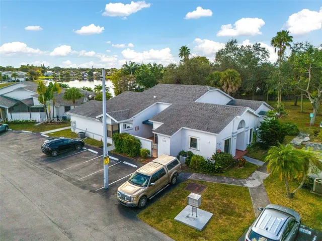 an aerial view of a houses with outdoor space