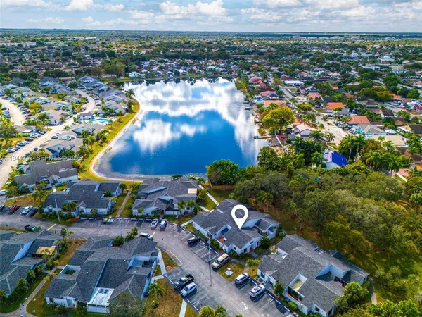 an aerial view of a house with a lake view