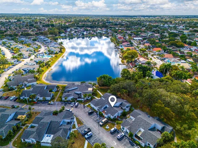 an aerial view of a house with a lake view
