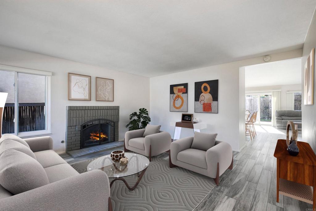 4413 Point Degada Oceanside, CA 92058 - Photo 2 of 46 a living room with furniture and a fireplace