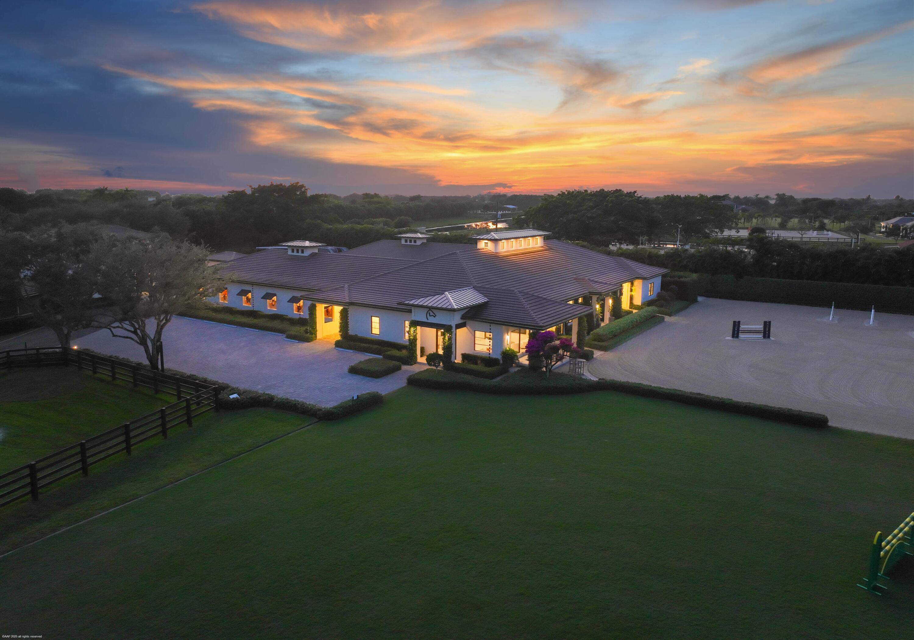 4675 Stables Way Wellington, FL 33414 - Photo 15 of 16 an aerial view of residential houses with outdoor space and trees