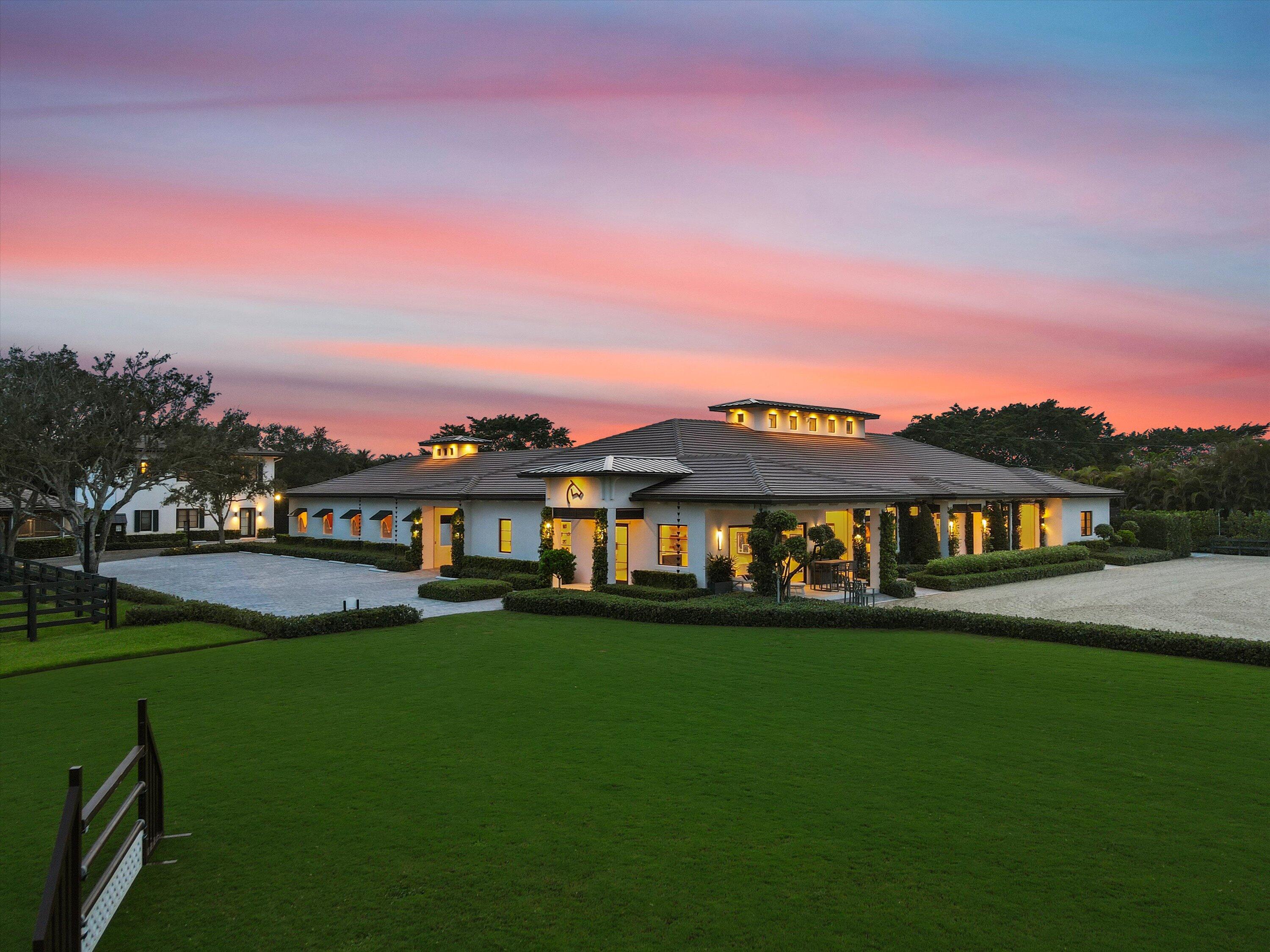 4675 Stables Way Wellington, FL 33414 - Photo 16 of 16 a view of a house with a big yard