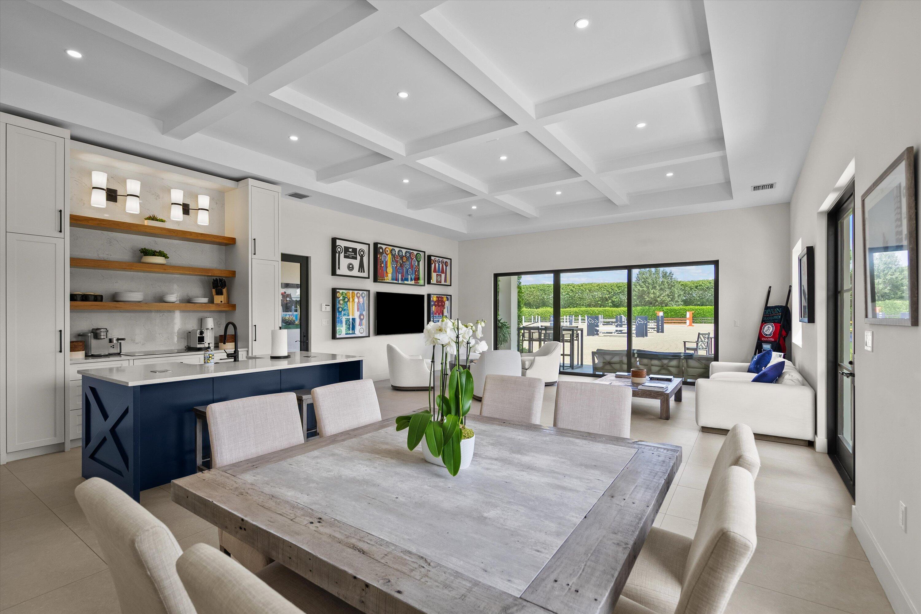 4675 Stables Way Wellington, FL 33414 - Photo 3 of 16 a living room with furniture large windows and wooden floor
