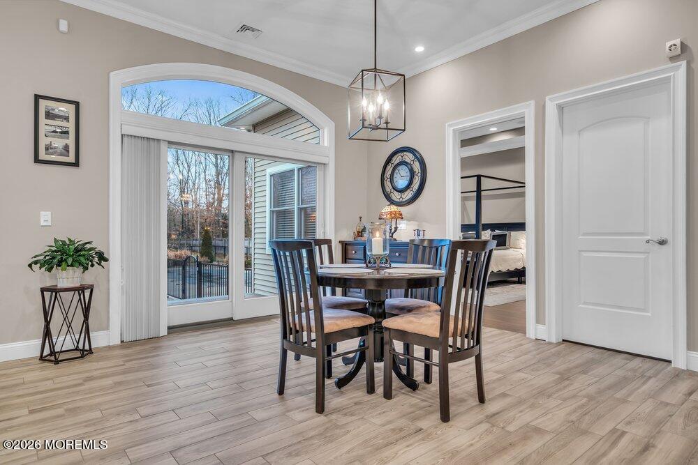 224 Grawtown Road Jackson, NJ 08527 - Photo 13 of 33 a view of a dining room with furniture window and wooden floor