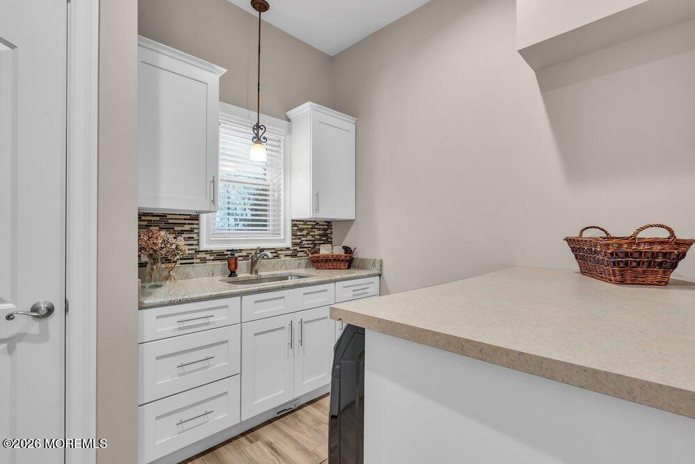 224 Grawtown Road Jackson, NJ 08527 - Photo 14 of 33 a kitchen with a sink and a refrigerator
