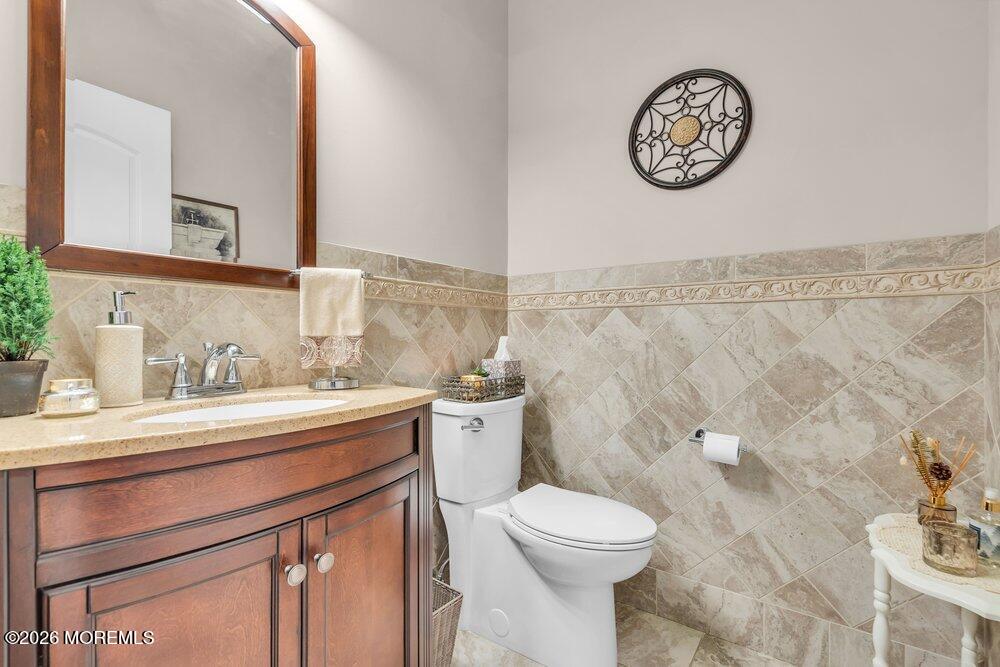 224 Grawtown Road Jackson, NJ 08527 - Photo 16 of 33 a bathroom with a granite countertop toilet sink and mirror