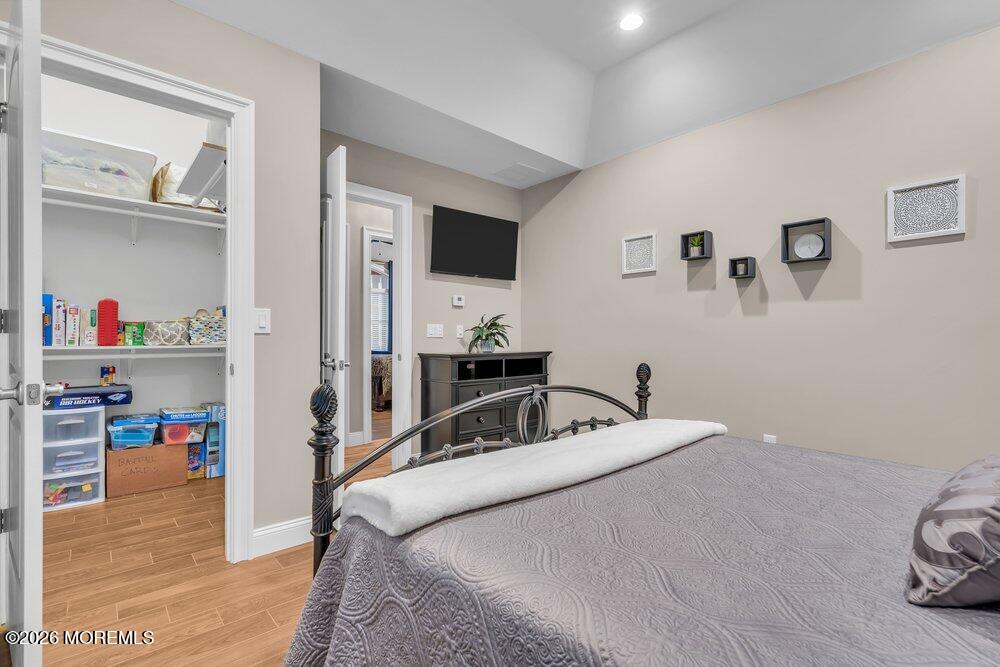 224 Grawtown Road Jackson, NJ 08527 - Photo 21 of 33 a bedroom with a bed and cabinets