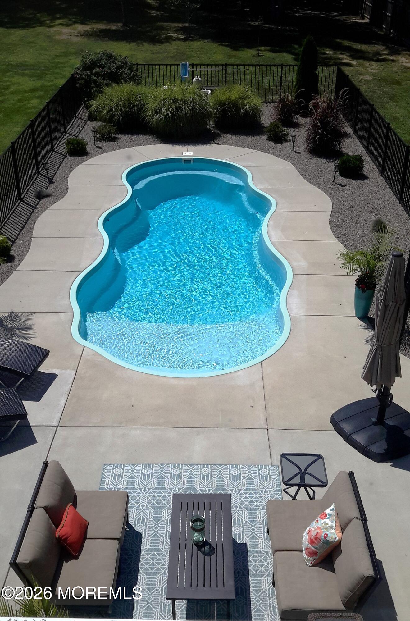 224 Grawtown Road Jackson, NJ 08527 - Photo 28 of 33 a swimming pool with outdoor seating yard and green space