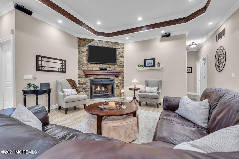 224 Grawtown Road Jackson, NJ 08527 - Photo 7 of 33 a living room with furniture a flat screen tv and a fireplace