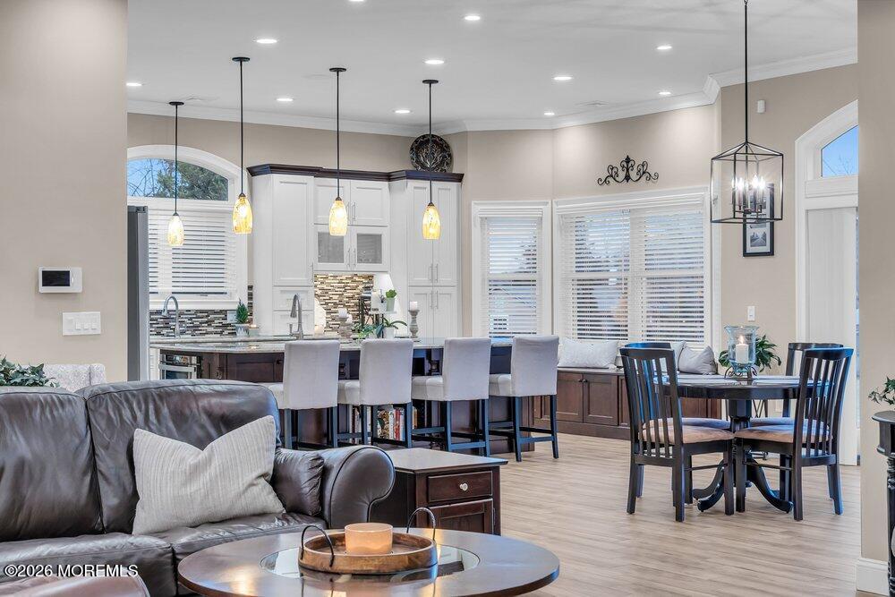 224 Grawtown Road Jackson, NJ 08527 - Photo 8 of 33 a living room with furniture kitchen area and a wooden floor