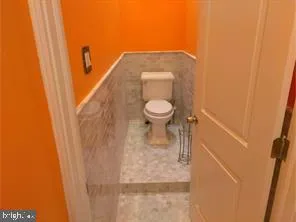 a bathroom with a toilet and a sink