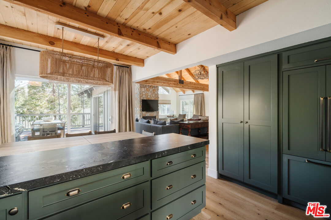 28805 North Shore Road Lake Arrowhead, CA 92352 - Photo 11 of 40 a view of a large room with a large window and wooden floor