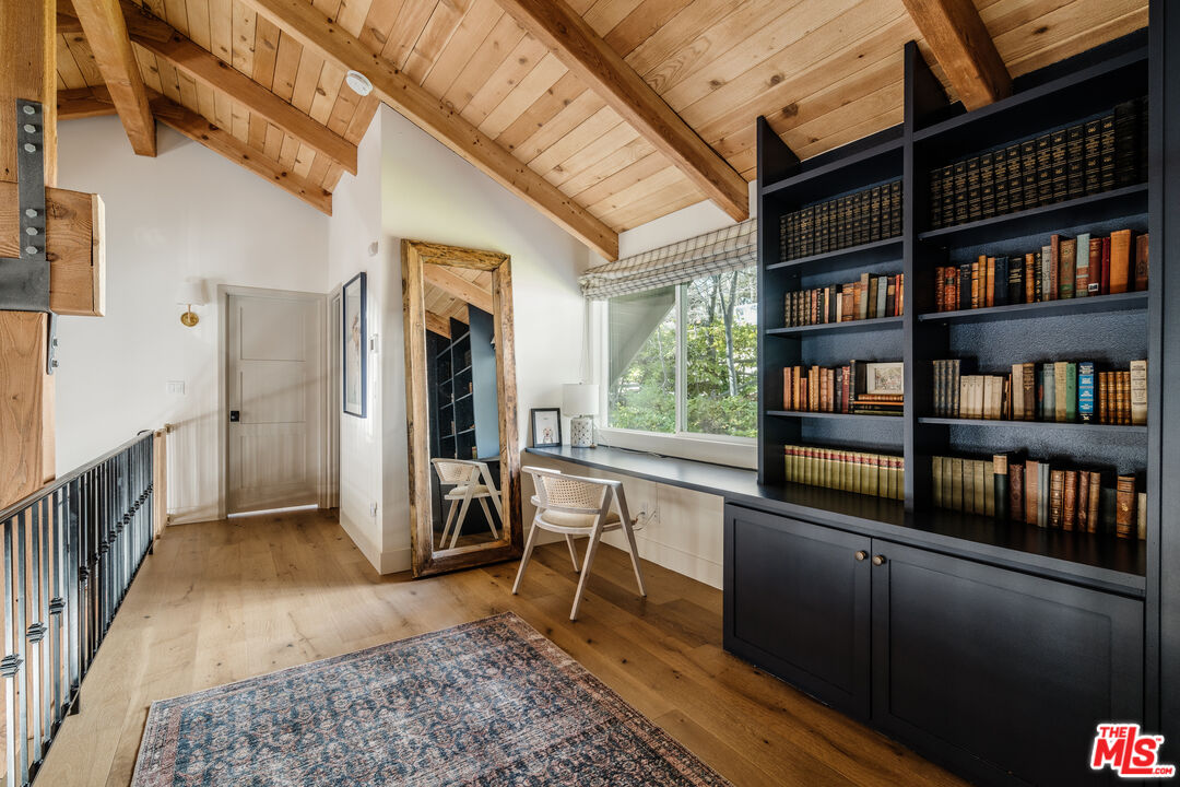 28805 North Shore Road Lake Arrowhead, CA 92352 - Photo 18 of 40 a view of a hallway with cabinet and a window