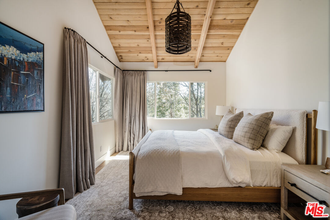 28805 North Shore Road Lake Arrowhead, CA 92352 - Photo 19 of 40 a bedroom with a bed and window