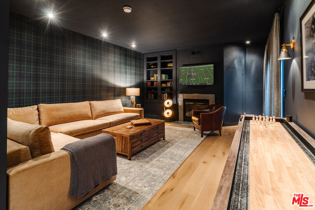 28805 North Shore Road Lake Arrowhead, CA 92352 - Photo 22 of 40 a living room with furniture and a flat screen tv