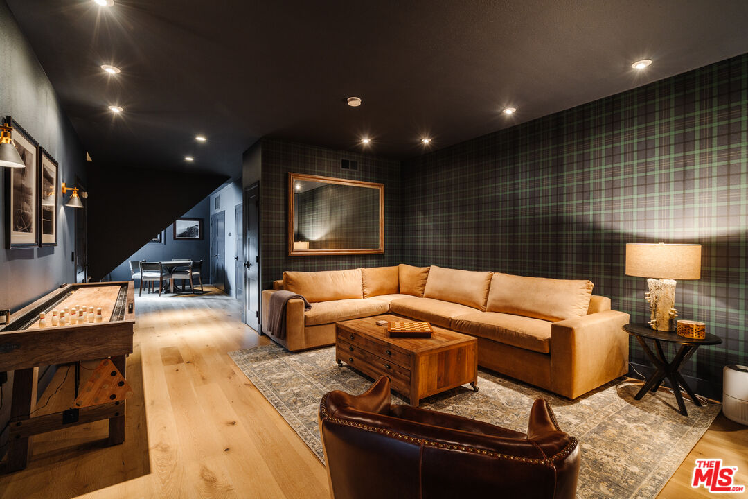 28805 North Shore Road Lake Arrowhead, CA 92352 - Photo 23 of 40 a living room with furniture and a flat screen tv