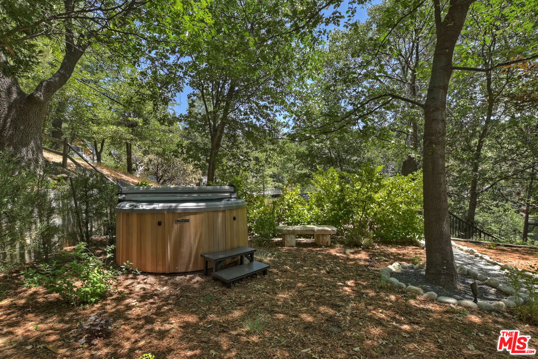 28805 North Shore Road Lake Arrowhead, CA 92352 - Photo 29 of 40 a view of a barn in the middle of a forest