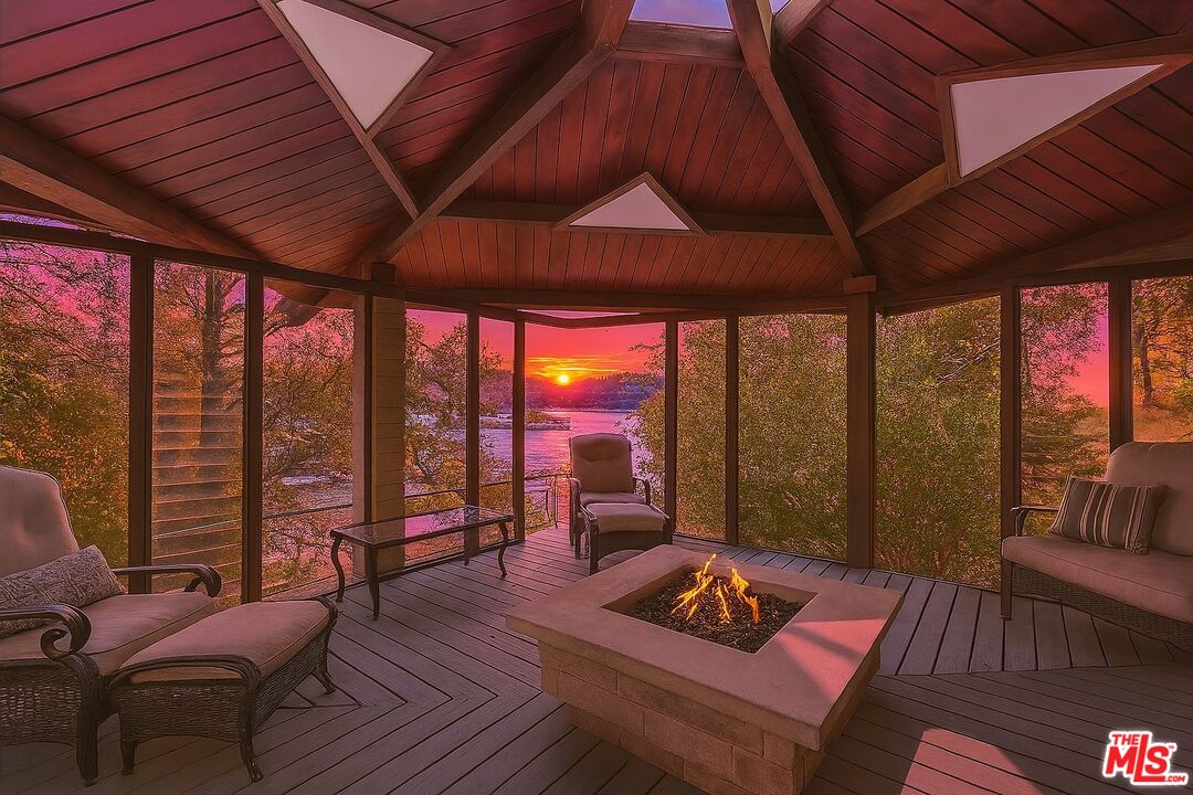 28805 North Shore Road Lake Arrowhead, CA 92352 - Photo 39 of 40 a living room with furniture and a floor to ceiling window