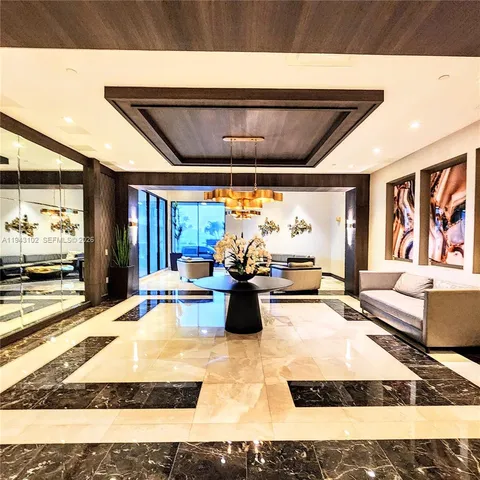 a view of a building with palm trees