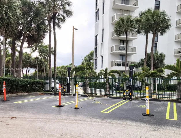 a lobby with furniture and a floor to ceiling window