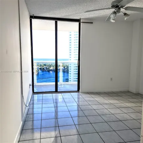 a view of an empty room with a window