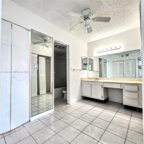a kitchen with a cabinets and chandelier