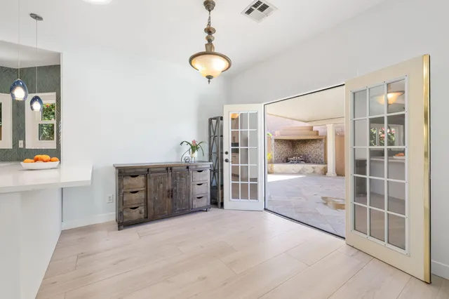 a room with a dresser and gym equipment