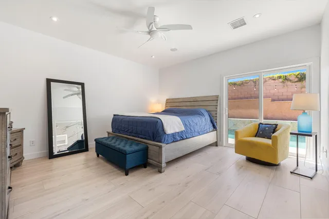 a bedroom with a bed and a couch