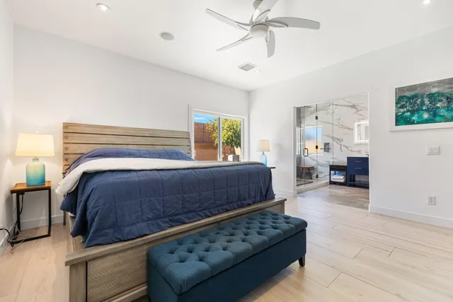 a bedroom with furniture and a window