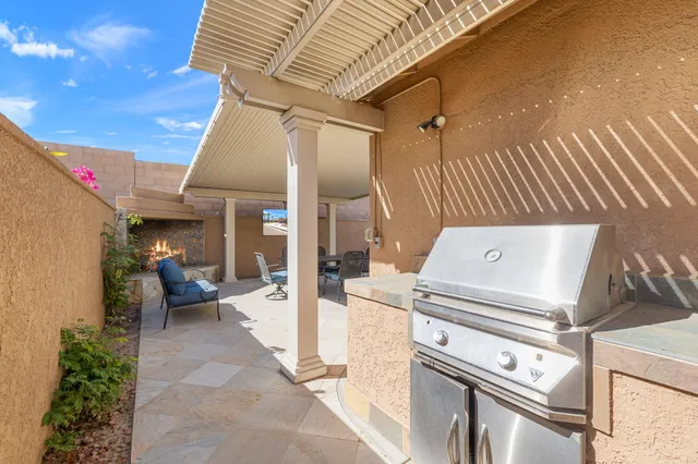 a aerial view of a house with a big yard and large trees