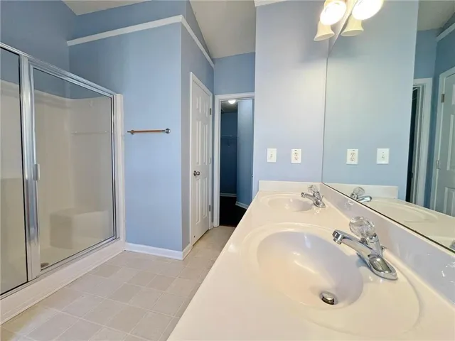 a en suite bathroom with a sink and a mirror