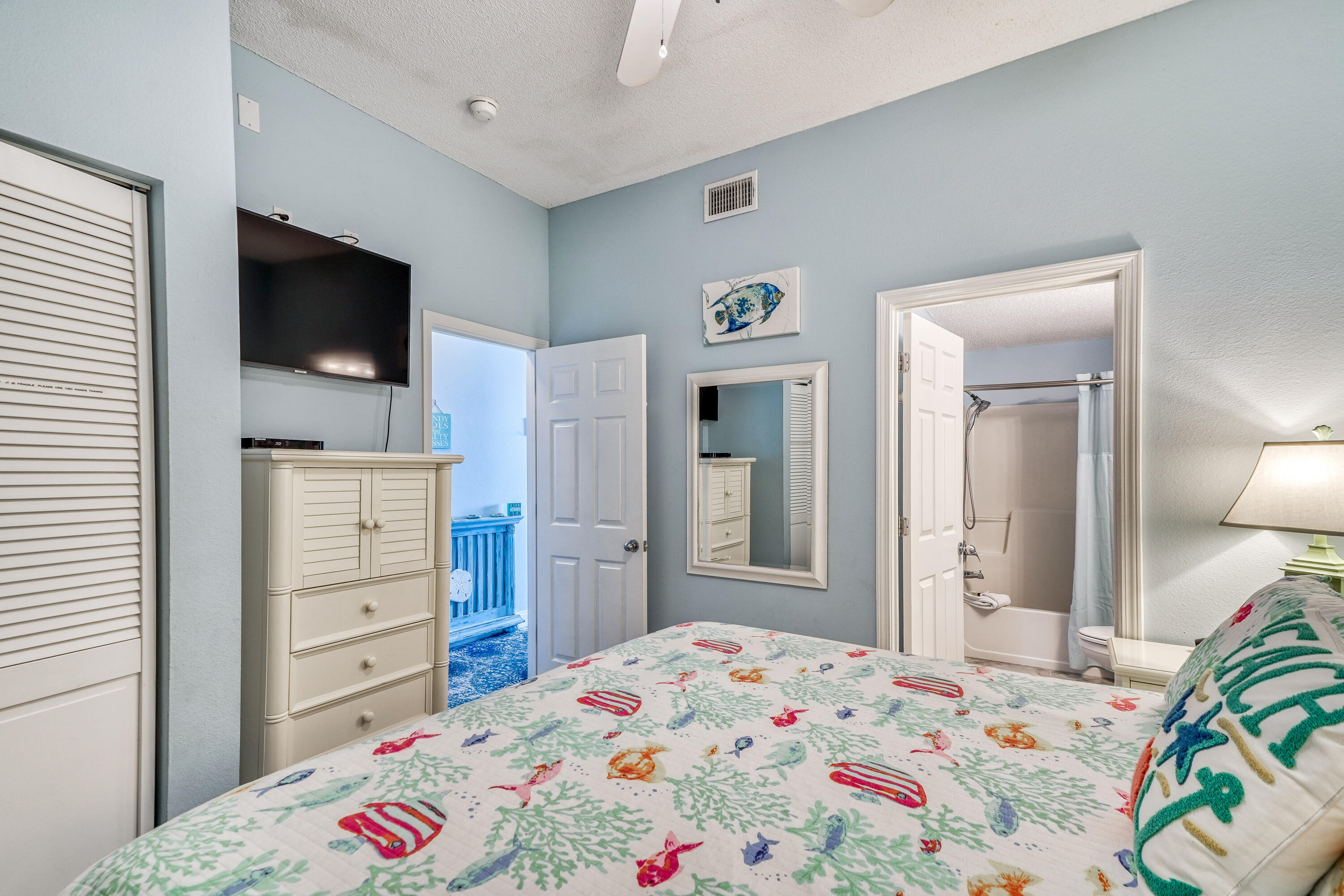 145 Spires Lane, Unit 406 Santa Rosa Beach, FL 32459 - Photo 9 of 38 a bedroom with a bed and a flat screen tv