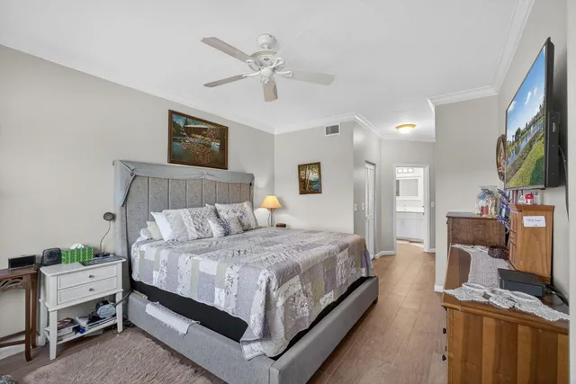 a kitchen with a sink dishwasher stove and white cabinets