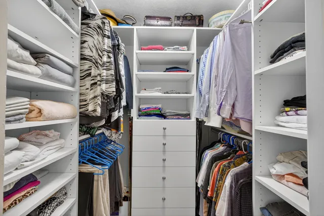 a dining room with furniture a window and wooden floor