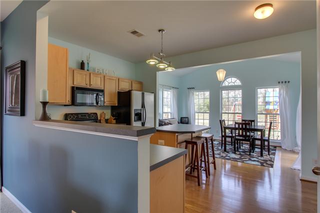 3003 Hope Circle Spring Hill, TN 37174 - Photo 6 of 20 Kitchen features gleaming HARDWOODS extending into the SUNROOM and 9' ceilings.