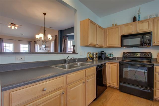 3003 Hope Circle Spring Hill, TN 37174 - Photo 7 of 20 This is a view of the kitchen overlooking dining and living room. Black appliances stay (refrigerator does not stay). Lots of cabinets and WORKSPACE.