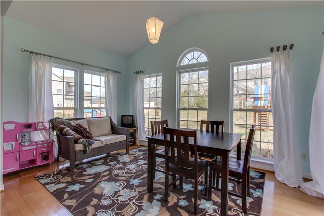 3003 Hope Circle Spring Hill, TN 37174 - Photo 9 of 20 Fabulous SUNROOM with HARDWOODS, tall THERMOPANE WINDOWS (one paladium to let in even more light). This sunroom exits to large 15x14 aggregate PATIO. Great home for entertaining.
