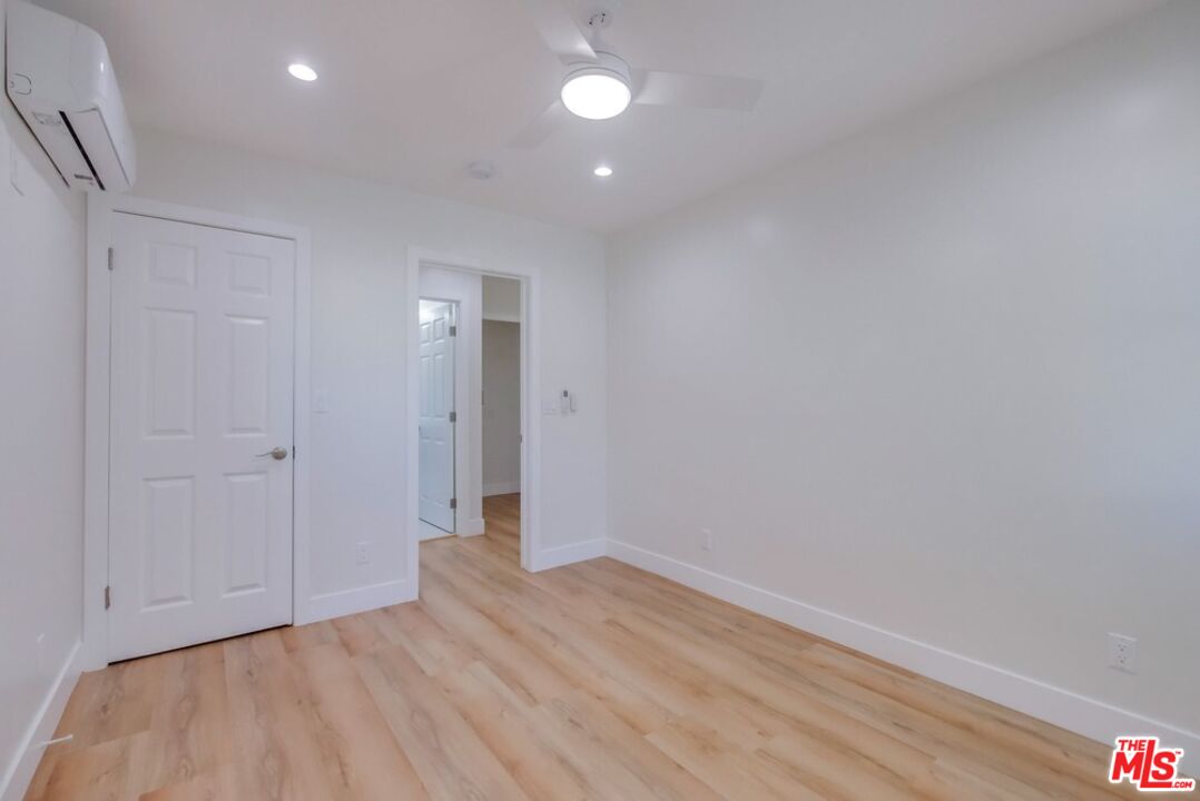 8356 Kittyhawk Avenue Los Angeles, CA 90045 - Photo 16 of 24 a view of empty room with wooden floor