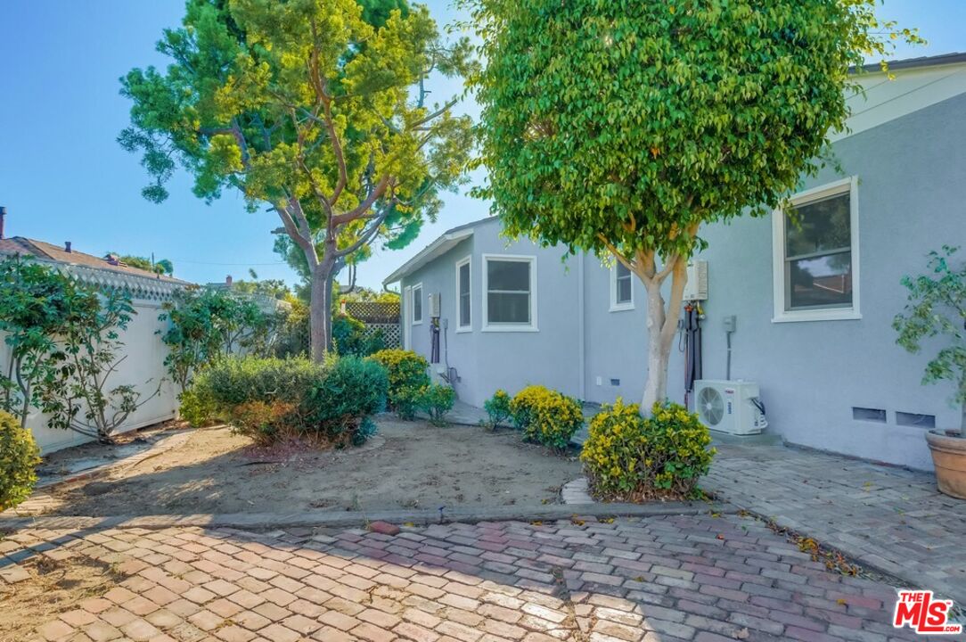 8356 Kittyhawk Avenue Los Angeles, CA 90045 - Photo 19 of 24 a front view of a house with garden
