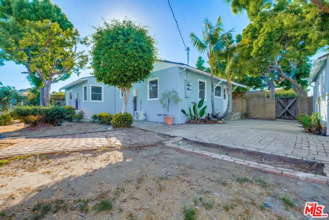 8356 Kittyhawk Avenue Los Angeles, CA 90045 - Photo 21 of 24 a house with a tree in front of it