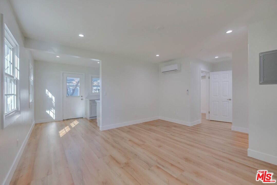 8356 Kittyhawk Avenue Los Angeles, CA 90045 - Photo 3 of 24 a view of empty room with wooden floor