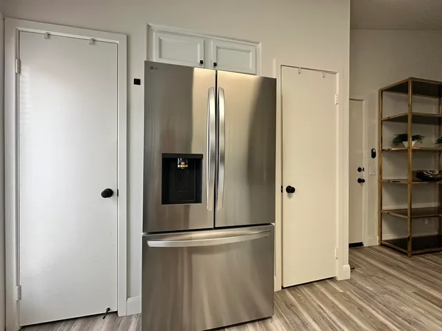 a refrigerator freezer sitting inside of a kitchen