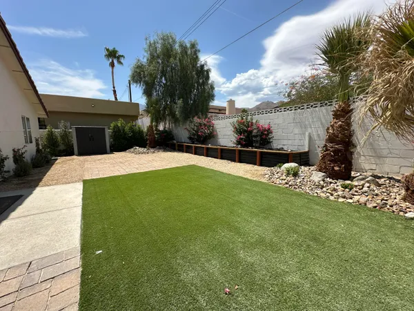 a house view with a garden space