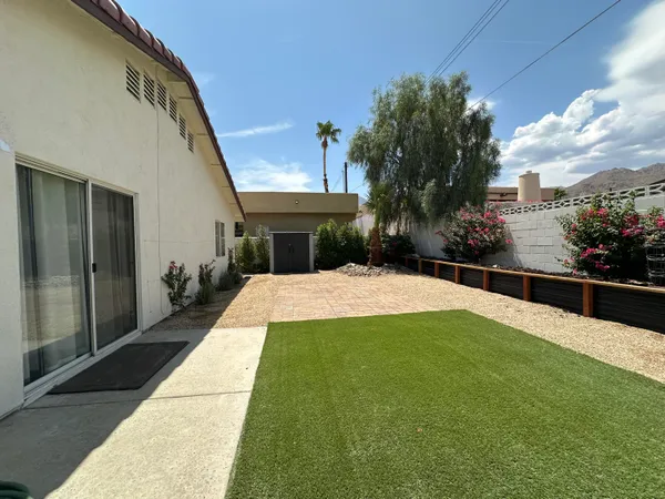 a view of swimming pool with a patio